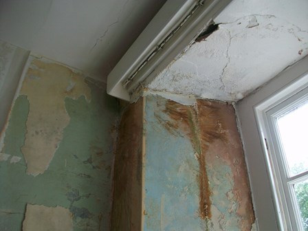 The interior of the building was in poor condition; suffering from penetrating damp, wet rot and cracking masonry at window heads/ lintels: Cushendun, Co. Antrim, Northern Ireland