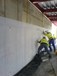 New build basement; cavity drain waterproofing system.  Technicians fixing the membrane to the retaining walls, at Strabane, Co. Tyrone NI