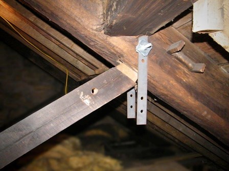 The trusses had slipped out of place due to the wet rot decay.  Temporary stays, installed by the church, are visible, at Falkirk, Stirlingshire, Scotland 