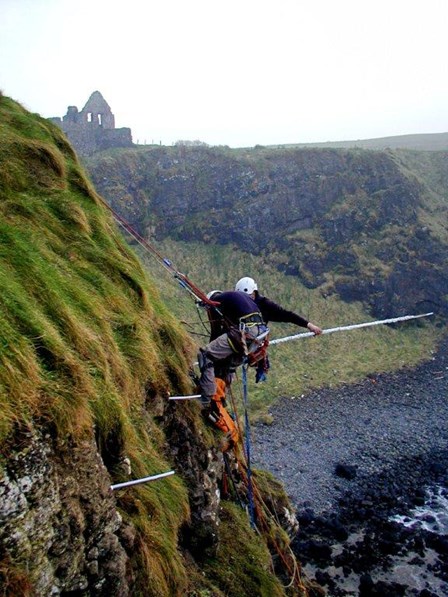 Cintec anchors being installed to the cliff face at Dunluce Castle, by rope access, Co. Antrim, Northern Ireland
