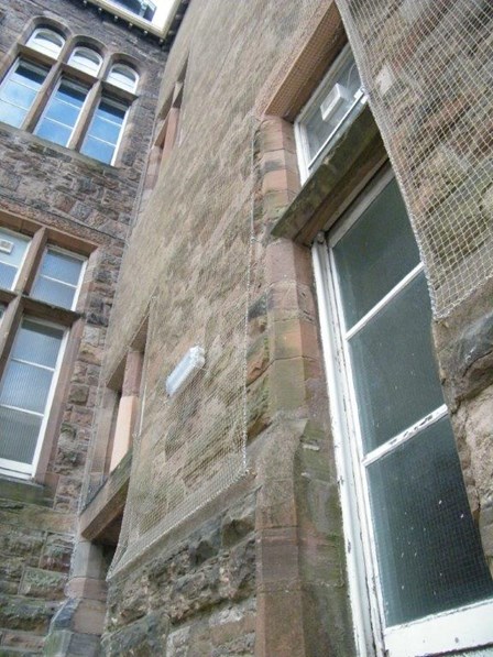 Masonry consolidation netting was fixed to the stone walls, providing a discreet finish, at Belfast Royal Academy, Co. Antrim, NI