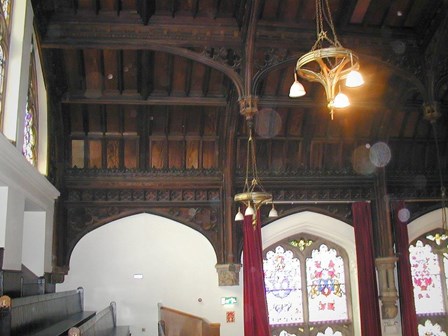 The existing timber panelling and trusses, which were suffering from damp, wet & dry rot, and woodworm infestation at The Guildhall, Derry, NI