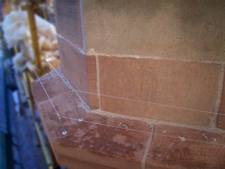 Bird wire on ledges to deter pigeons and birds, at The Guildhall, Londonderry, Northern Ireland