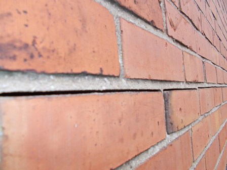 Close up of the vertical expansion of the bed joints, appearing as an horizontal crack in the external walls in this house in Belfast 